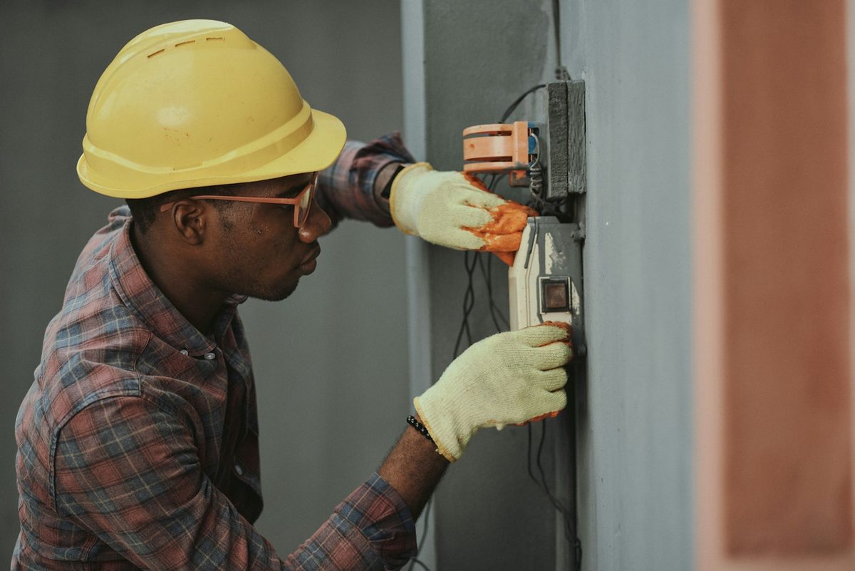 Illustrative stock photograph of an electrical worker; not a Poole employee or customer job.